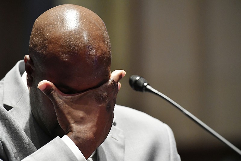 Philonise Floyd, a brother of George Floyd, wipes his face as he testifies during a House Judiciary Committee hearing on proposed changes to police practices and accountability on Capitol Hill, Wednesday, June 10, 2020, in Washington. (Mandel Ngan/Pool via AP)