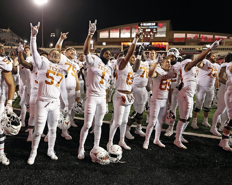 AP photo by Brad Tollefson / University of Texas football players sing "The Eyes of Texas" after road game against Texas Tech on Nov. 10, 2018, in Lubbock. A group of UT student-athletes has urged the school to rename several campus buildings, change the traditional school song and donate a percentage of athletic department revenue to organizations supporting the Black Lives Matter movement.