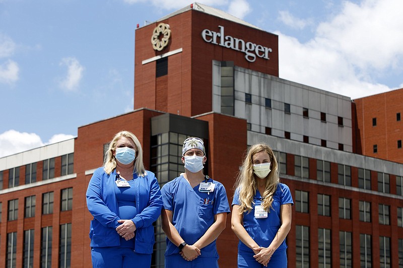 Staff photo by C.B. Schmelter / Critical care nursers Tracy Headrick, left, Cody Sims and Victoria Hunter pose at Erlanger on Thursday, June 11, 2020 in Chattanooga, Tenn.