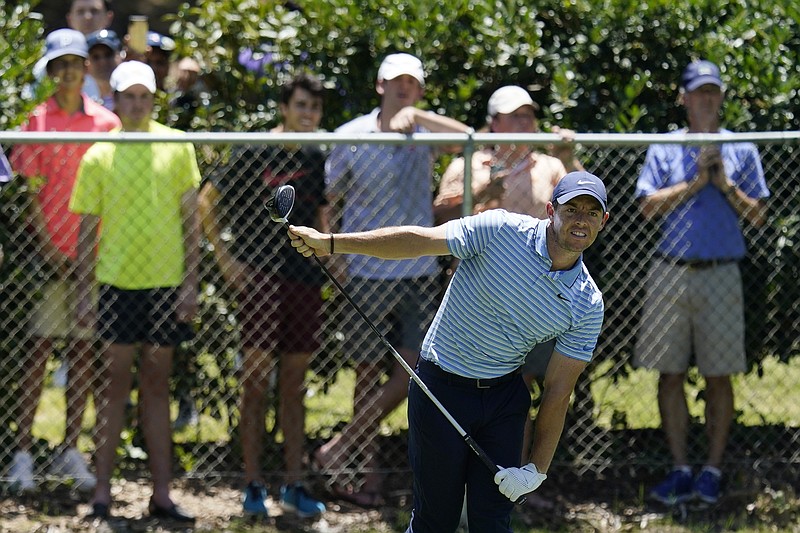 AP photo by David J. Phillip / Top-ranked Rory McIlroy watches his tee shot on the second hole at Colonial Country Club during the third round of the Charles Schwab Challenge on Saturday in Fort Worth, Texas.