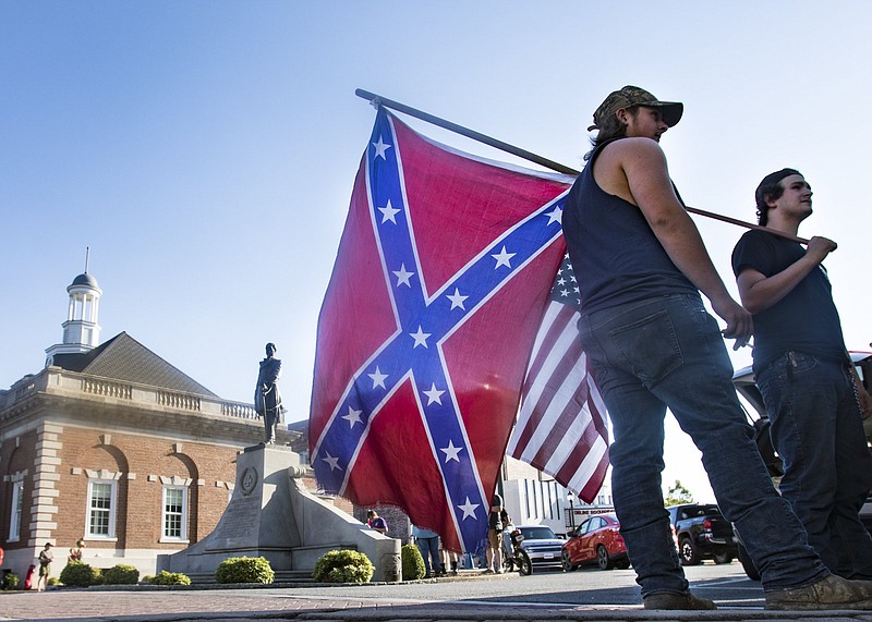 Staff photo by Troy Stolt / Counter protesters stand on the corner of Hamilton and Crawford Streets during protests over Dalton's statue of Confederate General Joseph E. Johnston on Saturday, June 13, 2020 in Dalton, Georgia.