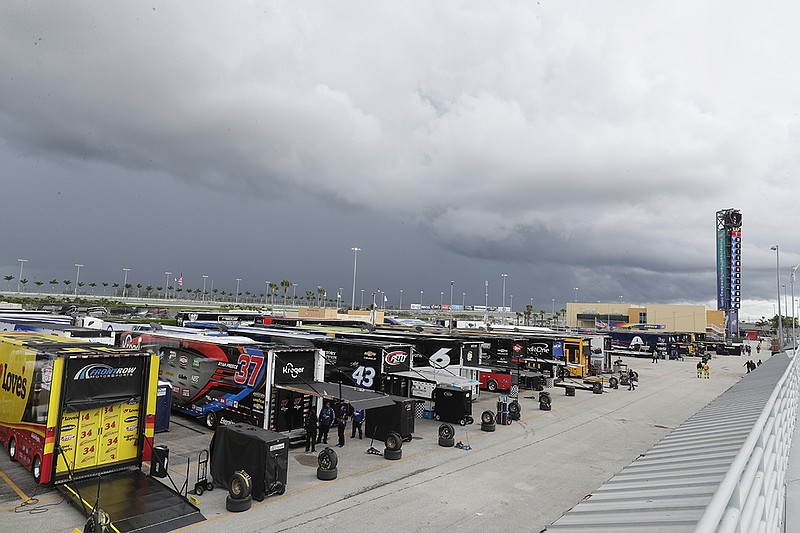 AP photo by Wilfredo Lee / Dark clouds hang over Homestead-Miami Speedway during a weather delay for Sunday's NASCAR Cup Series race in Homestead, Fla.