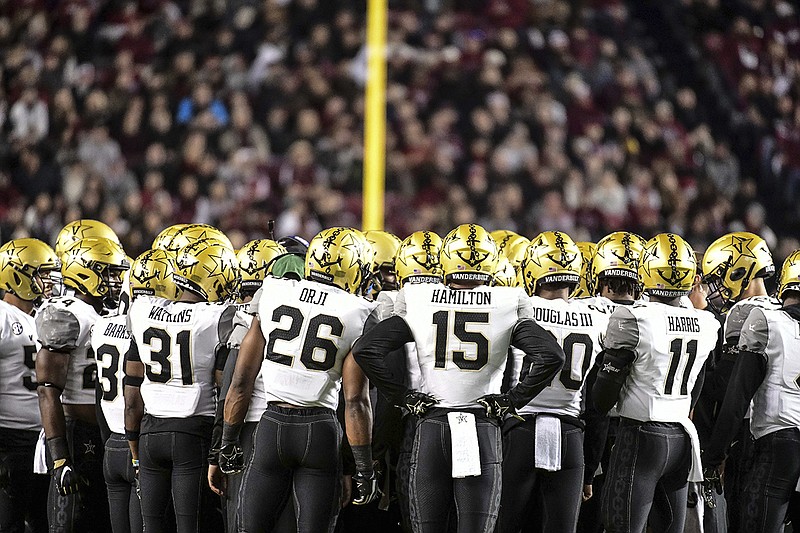 AP photo by Sean Rayford / Vanderbilt football players huddle during an SEC game at South Carolina on Nov. 2, 2019.