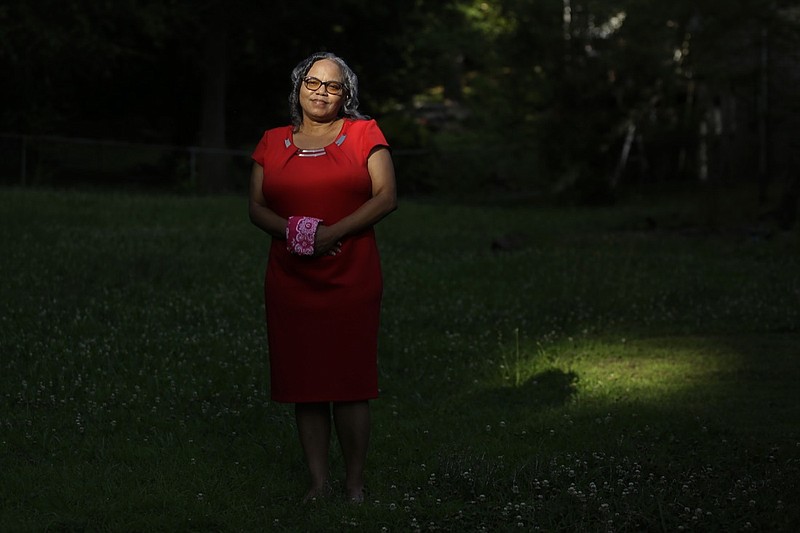 In this Monday, June 8, 2020, file photo, Dorothy Griffin, of Atlanta, poses for a portrait in Atlanta. Blind voters like Griffin fear a loss of control over their ability to cast a ballot as election officials across the U.S. plan a major expansion of voting by mail amid the coronavirus pandemic. Griffin requested an absentee ballot for Georgia's primary Tuesday, but she gave up waiting for it and decided to cast a ballot in person on the last day of early voting to avoid crowds on Election Day. (AP Photo/Brynn Anderson)