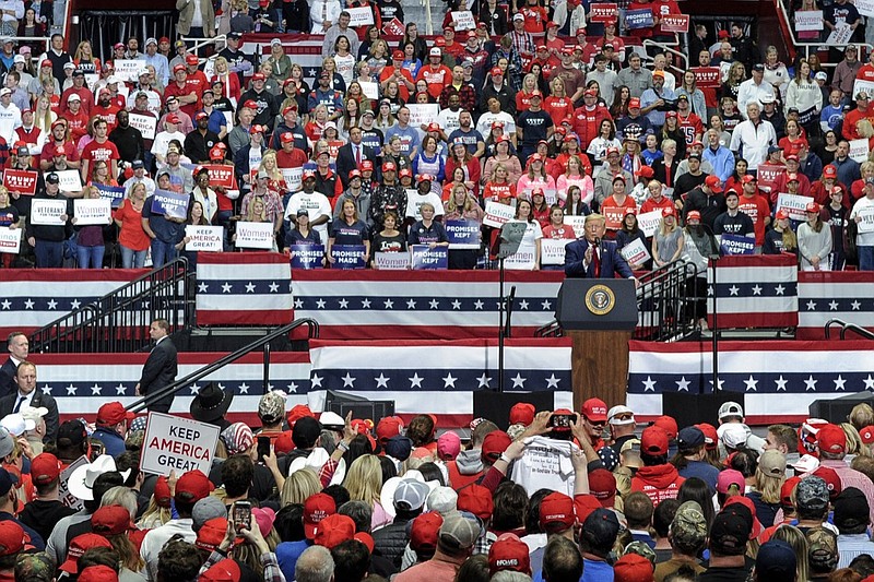 FILE - In this March 2, 2020 file photo, President Donald Trump speaks during a campaign rally in Charlotte, N.C. Trump's re-election campaign is planning a large indoor rally next week raising concern among health experts about how it might spread the coronavirus. Oklahoma health authorities say anyone who attends a large public event should get tested for COVID-19 shortly after. (AP Photo/Mike McCarn)
