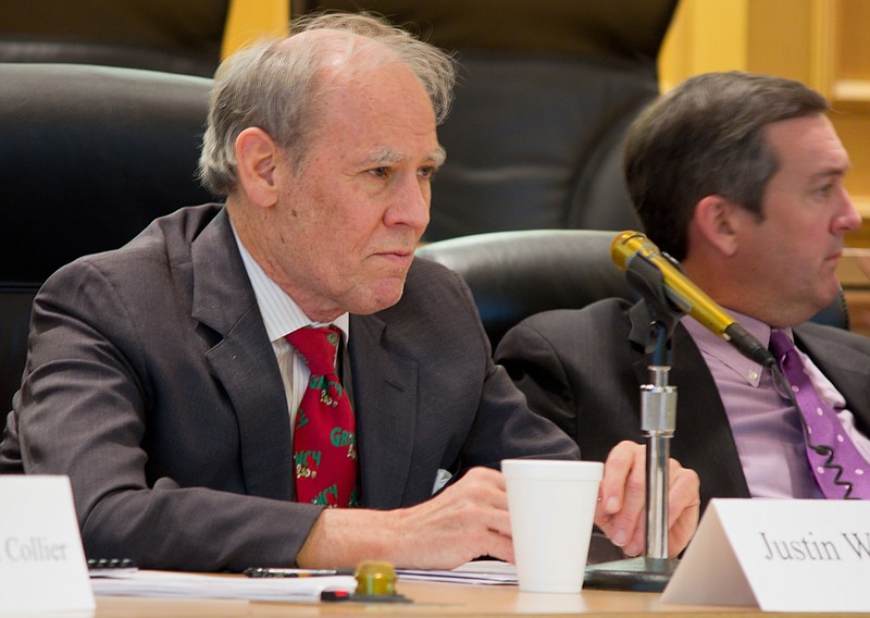 Comptroller Justin Wilson, left, attends a meeting of the State Funding Board in Nashville, Tenn., in Friday, Dec. 9, 2011. (AP Photo/Erik Schelzig)