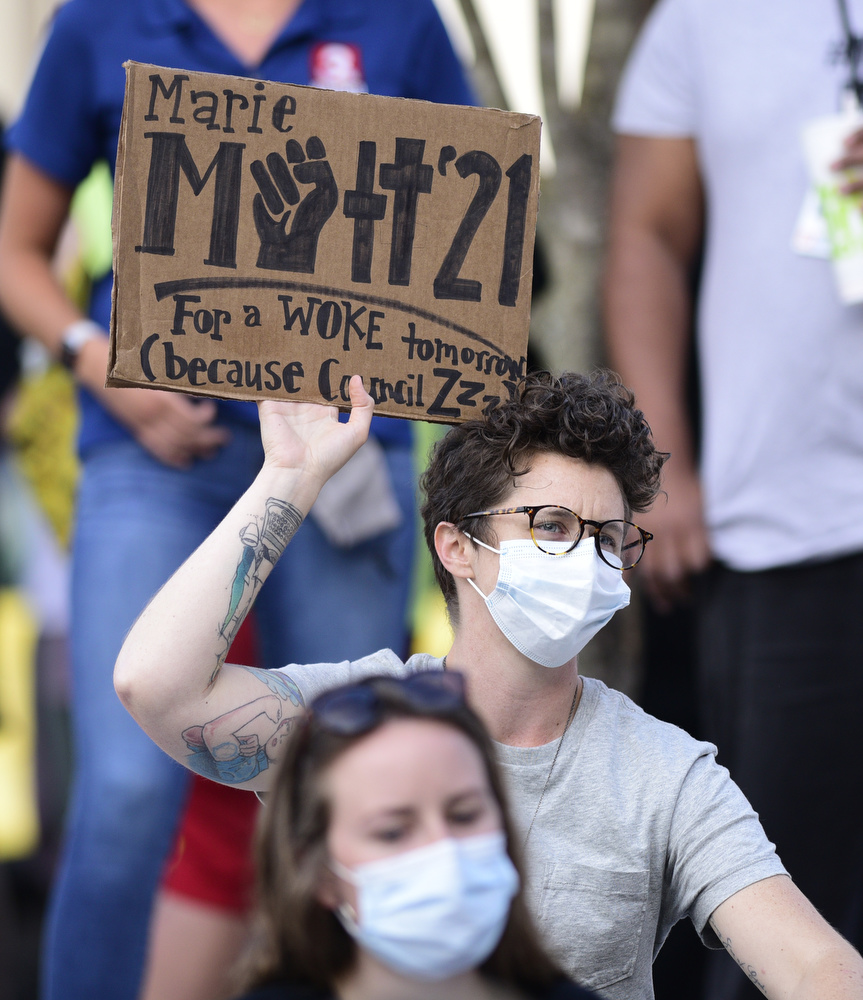 Staff Photo by Robin Rudd / A protester holds a sign endorsing Marie Mott for the Chattanooga City Council. Protesters gathered at Miller Park and marched south past some of Chattanooga's tourism icons in reaction to the killing of George Floyd and other police brutalities on June 17, 2020.