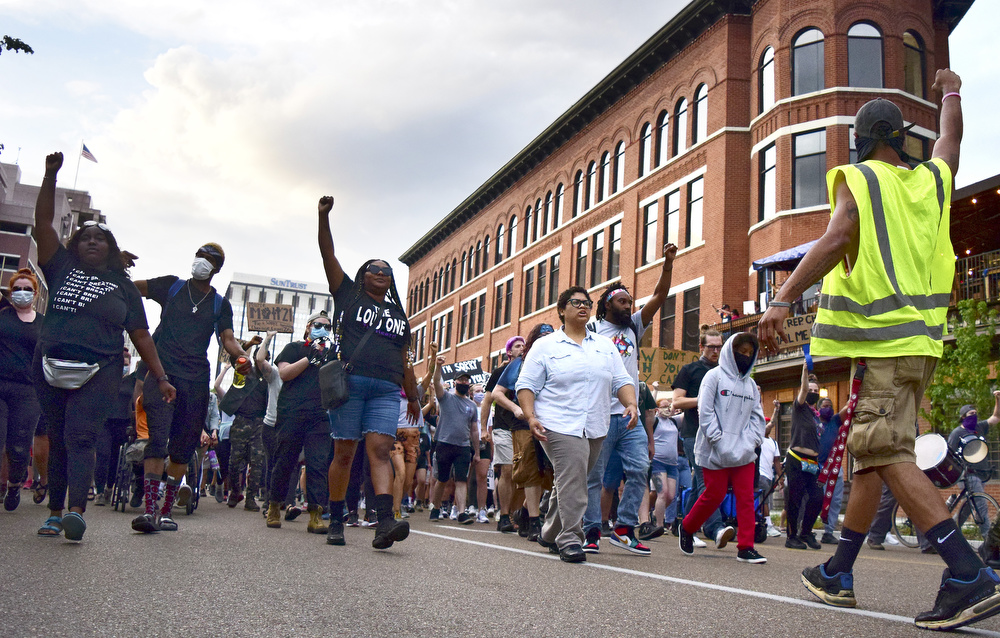 Staff Photo by Robin Rudd / The march passes the Pickle Barrel as it starts south on Market Street. Protesters gathered at Miller Park and marched south past some of Chattanooga's tourism icons in reaction to the killing of George Floyd and other police brutalities on June 17, 2020.