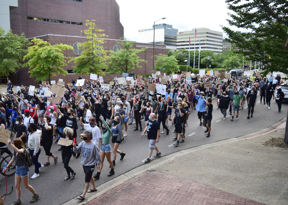 Staff Photo by Robin Rudd / The march passes the TVA complex on Market Street. Protesters gathered at Miller Park and marched south past some of Chattanooga's tourism icons in reaction to the killing of George Floyd and other police brutalities on June 17, 2020.