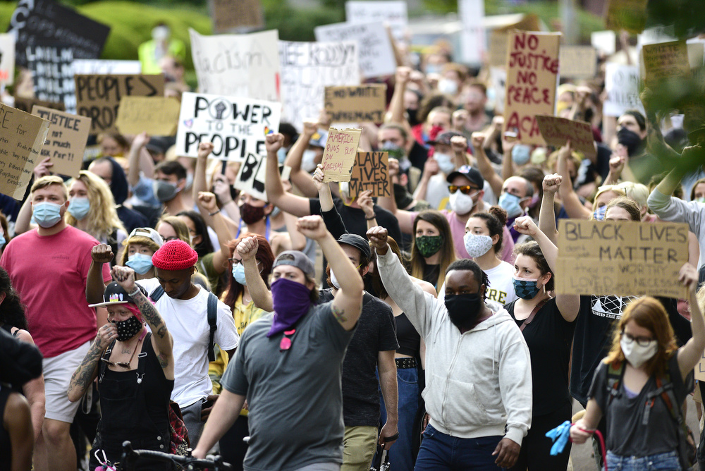 Staff Photo by Robin Rudd / The march progresses down Market Street. Protesters gathered at Miller Park and marched south past some of Chattanooga's tourism icons in reaction to the killing of George Floyd and other police brutalities on June 17, 2020.