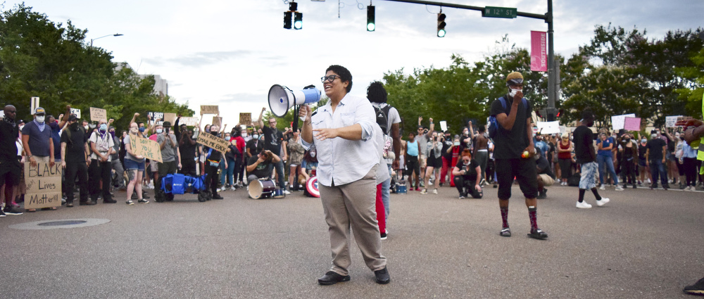 Staff Photo by Robin Rudd / Marie Mott addresses the protesters as the march pauses at the intersection of Houston and Market Streets. Protesters gathered at Miller Park and marched south past some of Chattanooga's tourism icons in reaction to the killing of George Floyd and other police brutalities on June 17, 2020.