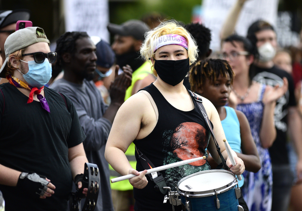 Staff Photo by Robin Rudd / A drummer helps the march keep pace. Protesters gathered at Miller Park and marched south past some of Chattanooga's tourism icons in reaction to the killing of George Floyd and other police brutalities on June 17, 2020.