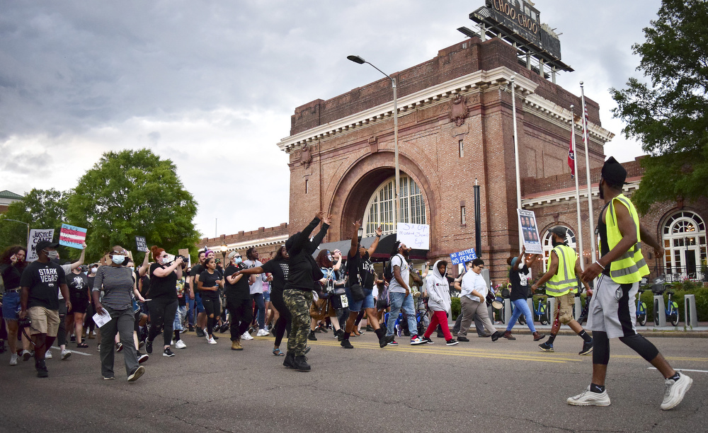 Staff Photo by Robin Rudd / The march passes the Chattanooga Choo Choo as it heads to the Southside. Protesters gathered at Miller Park and marched south past some of Chattanooga's tourism icons in reaction to the killing of George Floyd and other police brutalities on June 17, 2020.