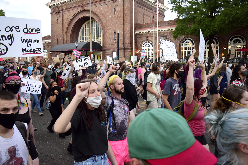 Staff Photo by Robin Rudd / Protesters march past the Chattanooga Choo Choo as they approach the Southside. Protesters gathered at Miller Park and marched south past some of Chattanooga's tourism icons in reaction to the killing of George Floyd and other police brutalities on June 17, 2020.