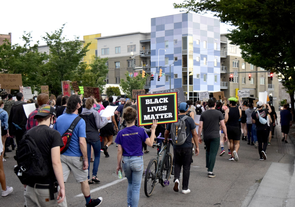 Staff Photo by Robin Rudd / The march passes the Chattanooga Choo Choo as it heads to the Southside. Protesters gathered at Miller Park and marched south past some of Chattanooga's tourism icons in reaction to the killing of George Floyd and other police brutalities on June 17, 2020.