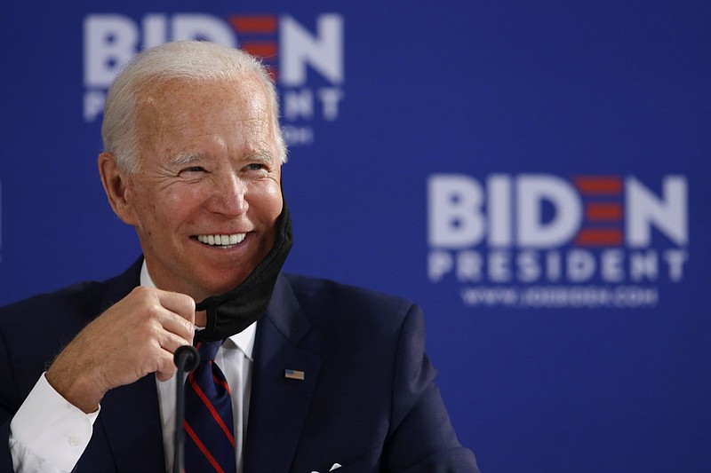 Democratic presidential candidate former Vice President Joe Biden smiles while speaking during a roundtable on economic reopening with community members, Thursday, June 11, 2020, in Philadelphia. (AP Photo/Matt Slocum)