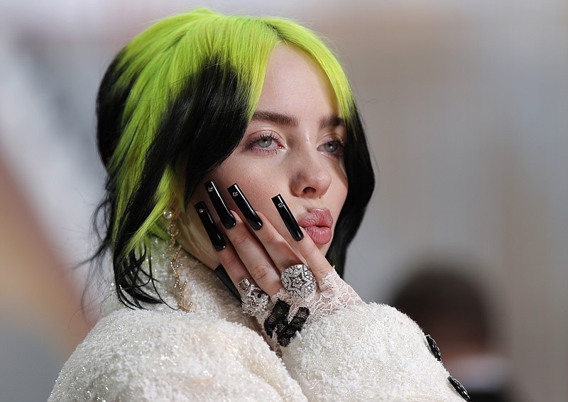 FILE - In this Feb. 9, 2020 file photo, singer Billie Eilish arrives at the Oscars in Los Angeles. A judge has extended to three years a restraining order taken out by Eilish against a man who repeatedly appeared at her Los Angeles home. (AP Photo/John Locher, File)


