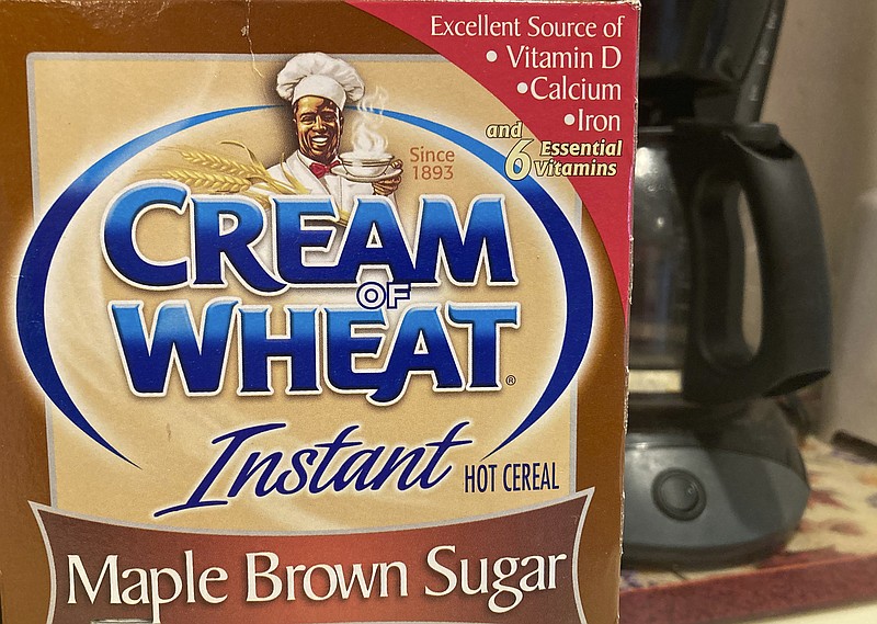 A box of Cream of Wheat is displayed on a counter, Thursday, June 18, 2020 in White Plains, N.Y. Cream of Wheat and Mrs. Butterworth are the latest brands reckoning with racially charged logos. B&G Foods Inc., which makes Cream of Wheat hot cereal, said it is initiating "an immediate review" of its packaging. A smiling black chef holding a bowl of cereal has appeared on Cream of Wheat packaging and in ads since at least 1918, according to the company's web site. (AP Photo/Donald King)