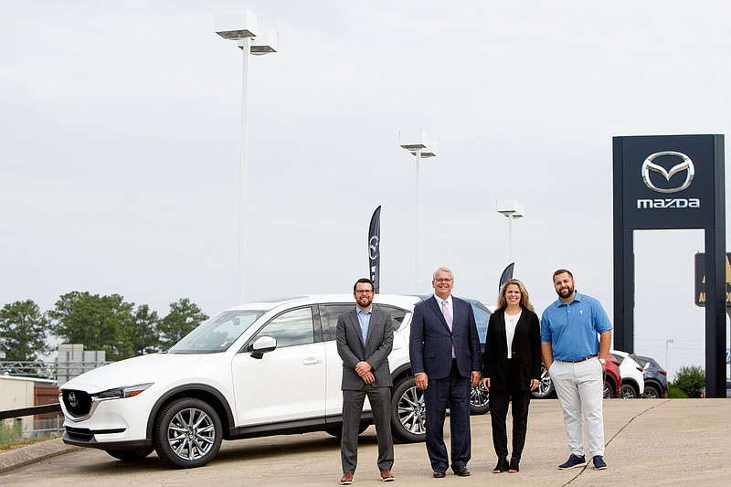 Staff photo by C.B. Schmelter / Jesse Morgan, left, Brent Morgan, Abigail Lockhart and Bailey Morgan pose at Integrity Mazda on Friday, June 19, 2020 in Chattanooga, Tenn. Jesse, Abigail and Bailey are vice presidents and Brent is the president of Integrity Automotive Group.
