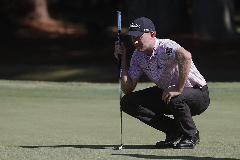 AP photo by Gerry Broome / Webb Simpson lines up his putt on the first green at Harbour Town Golf Links during the second round of the PGA Tour's RBC Heritage tournament Friday on Hilton Head Island, S.C.