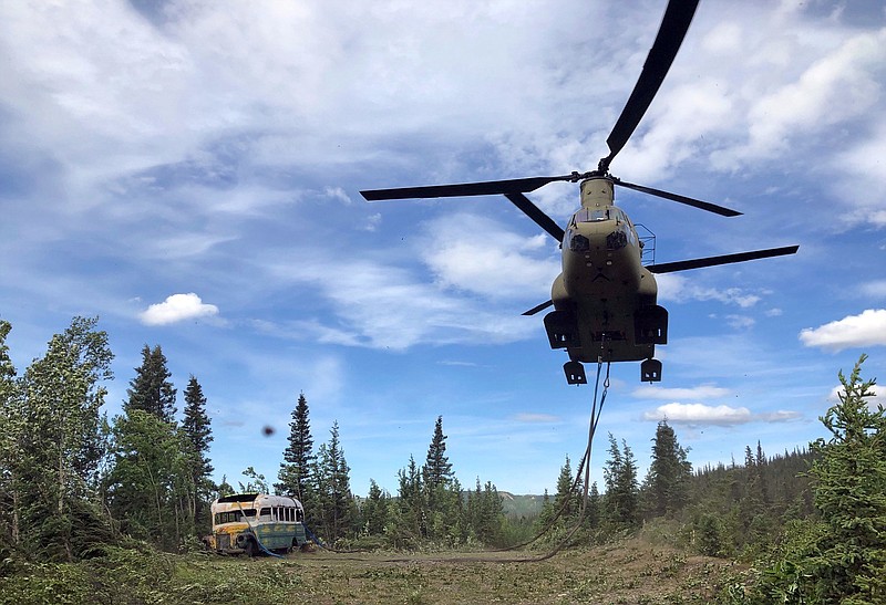 In this photo released by the Alaska National Guard, Alaska Army National Guard soldiers use a CH-47 Chinook helicopter to remove an abandoned bus, popularized by the book and movie "Into the Wild," out of its location in the Alaska backcountry Thursday, June 18, 2020, as part of a training mission. Alaska Natural Resources Commissioner Corri Feige, in a release, said the bus will be kept in a secure location while her department weighs various options for what to do with it. (Sgt. Seth LaCount/Alaska National Guard via AP)


