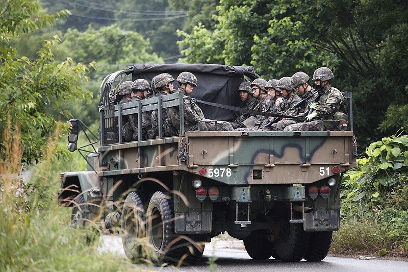 South Korean army soldiers ride on the back of a truck in Paju, South Korea, near the border with North Korea, Friday, June 19, 2020. South Korea said Thursday it hasn't detected any suspicious activities by North Korea, a day after it threatened with provocative acts at the border in violation of a 2018 agreement to reduce tensions. (AP Photo/Ahn Young-joon)


