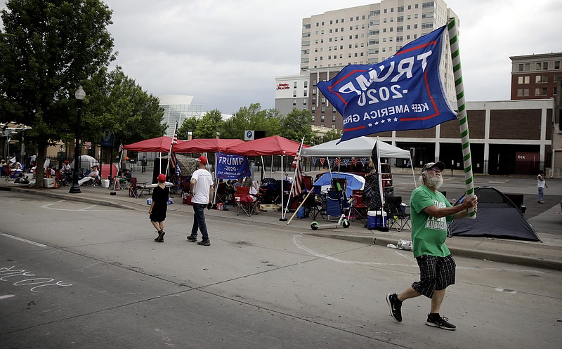 Mike Pellerin joins other Trump supporters on 4th Street and Cheyenne Ave. in downtown Tulsa, Okla., ahead of President Donald Trump's Saturday's campaign rally Friday, June 19, 2020. (Mike Simons/Tulsa World via AP)