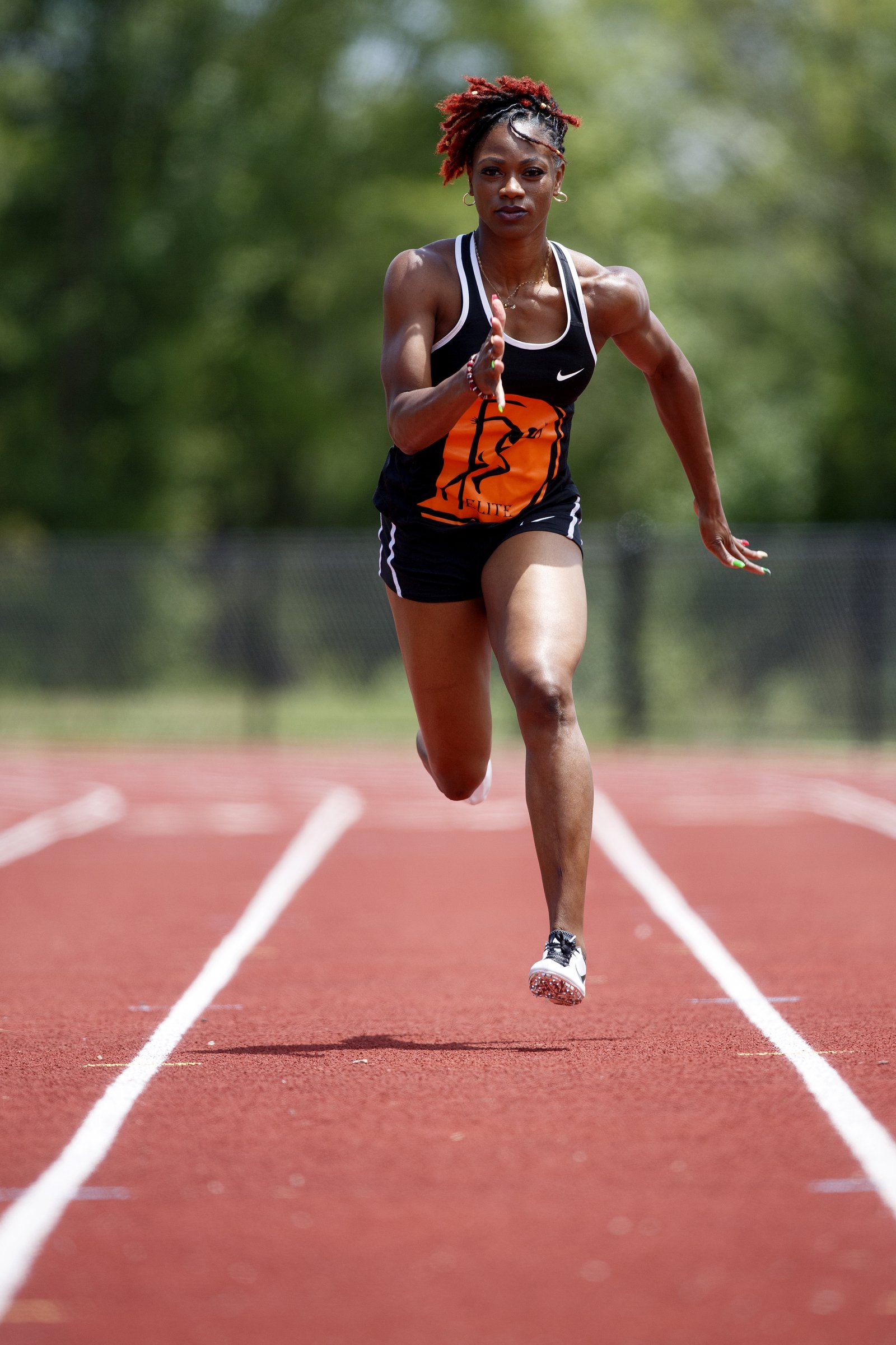 Staff photo by C.B. Schmelter / LaQuisha Jackson runs Tuesday at Brainerd High School. The former Howard star sprinter is back in her hometown to train as she pursues a dream of competing in the Olympics.
