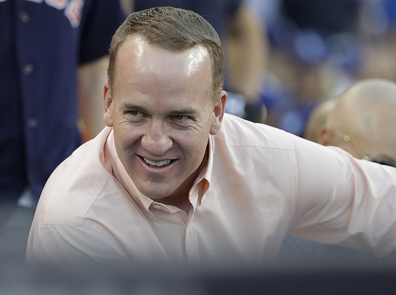 AP file photo by David J. Phillip / Former University of Tennessee and NFL quarterback Peyton Manning has helped community causes in Chattanooga on multiple occasions, including recent donations to area high school football programs affected by tornadoes this spring.