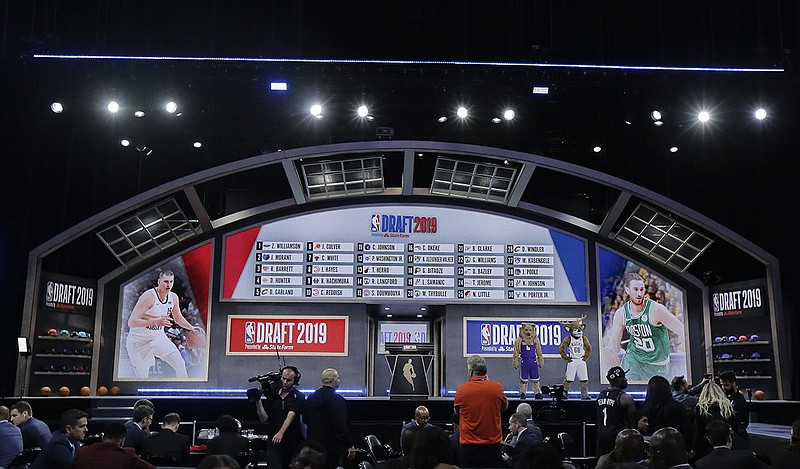 AP photo by Julio Cortez / A board displays the picks for the first round of the NBA draft on June 20, 2019, in New York.