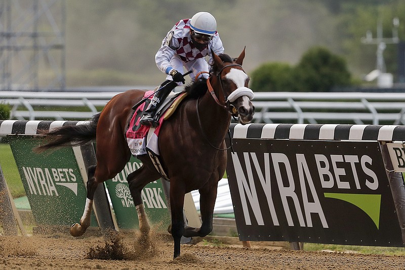 AP photo by Seth Wenig / Manny Franco rides Tiz the Law to victory Saturday at the Belmont Stakes in Elmont, N.Y. Tiz the Law, a New York-bred horse from Sackatoga Stable, gave 82-year-old trainer Barclay Tagg the final leg of the career Triple Crown of Thoroughbred Racing.