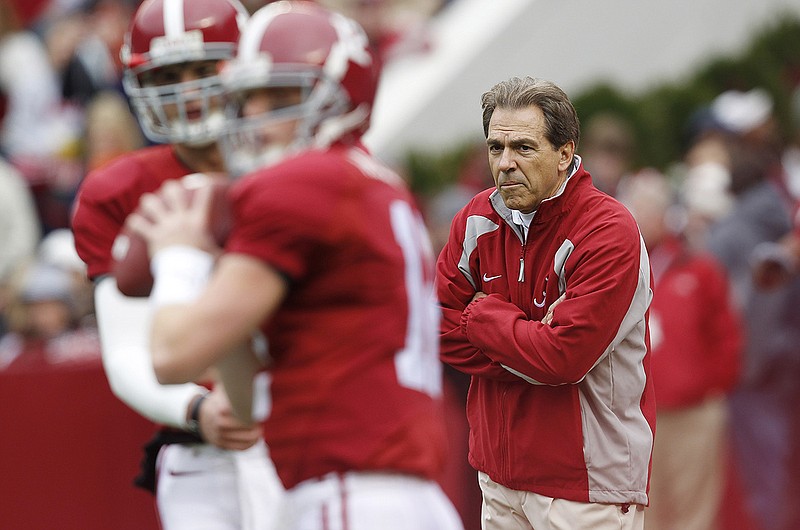 AP photo by Butch Dill / Alabama coach Nick Saban watches as his team warms up for its home game against Auburn on Nov. 26, 2010. The host Crimson Tide led the Iron Bowl 24-0 midway through the second quarter but wound up losing 28-27.