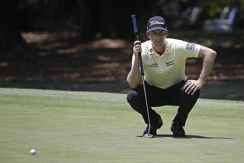 AP photo by Gerry Broome / Webb Simpson lines up a putt on the first green at Harbour Town Golf Links during the final round of the PGA Tour's RBC Heritage tournament Sunday on Hilton Head Island, S.C.