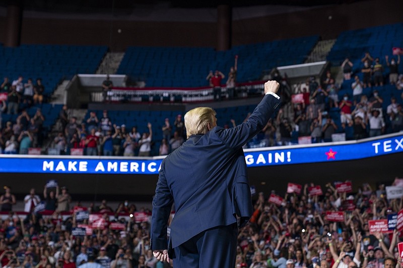 President Donald Trump arrives on stage to speak at a campaign rally at the BOK Center, Saturday, June 20, 2020, in Tulsa, Okla. (AP Photo/Evan Vucci)