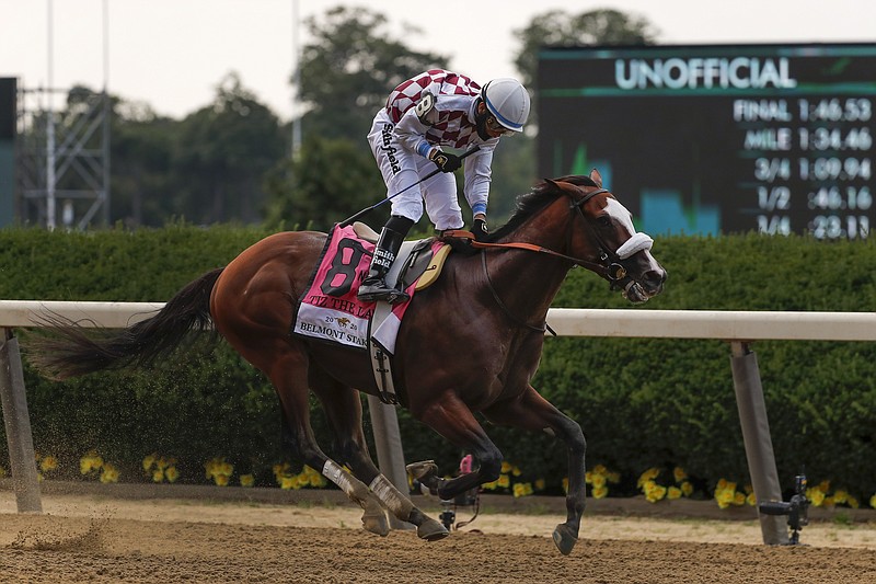 AP photo by Seth Wenig / Tiz the Law jockey Manny Franco reacts after the colt won the 152nd running of the Belmont Stakes on Saturday at Belmont Park in Elmont, N.Y.