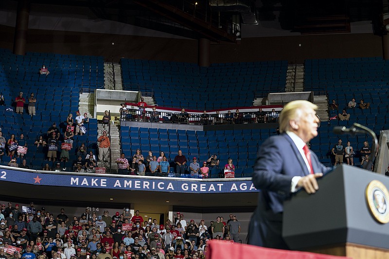 Photo by Doug Mills, The New York Times / President Donald Trump speaks at the half-filled BOK Center in Tulsa on Saturday during his first campaign rally since March 2.