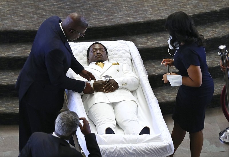 The body of Rayshard Brooks arrives for public viewing at Ebenezer Baptist Church on Monday, June 22, 2020 in Atlanta. Brooks died June 12 after being shot by an officer in a Wendy's parking lot and his death sparked protests in Atlanta and around the country. A private funeral for Brooks will be held Tuesday at the church. (Curtis Compton/Atlanta Journal-Constitution via AP, Pool)

