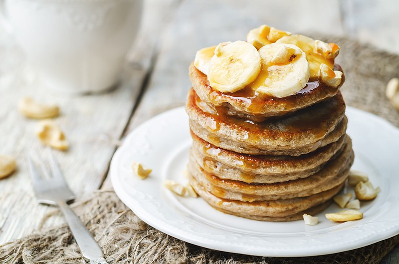 banana cashew pancakes with bananas and salted caramel sauce - stock photo food tile banana tile food tile pancakes tile / Getty Images
