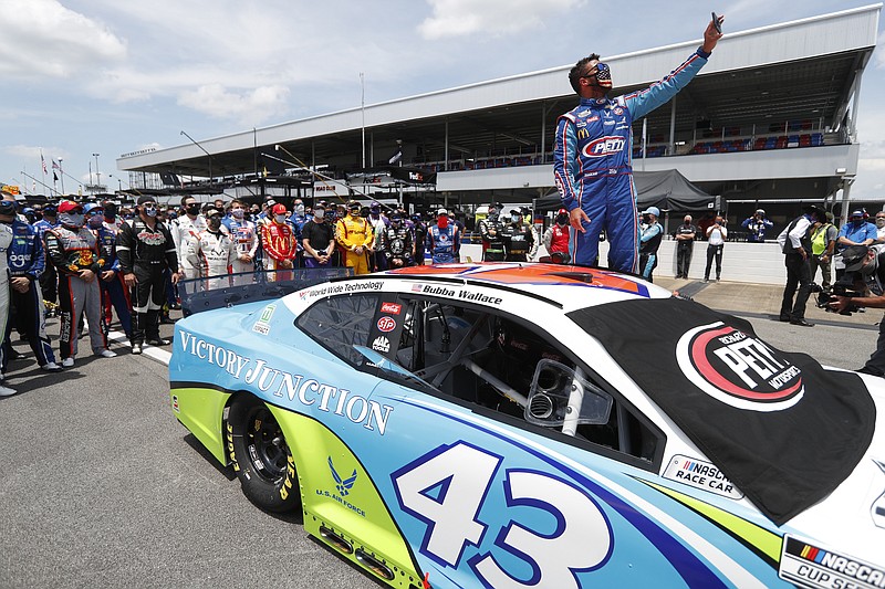 AP photo by John Bazemore / Bubba Wallace takes a selfie with fellow NASCAR Cup Series drivers who pushed his car to the front of the pits at Talladega Superspeedway before Monday's race at the Alabama track.