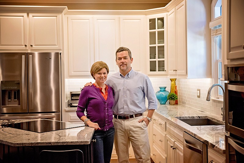 Photography by Nicole Manning / Dave and Kelli Holliday in their kitchen.