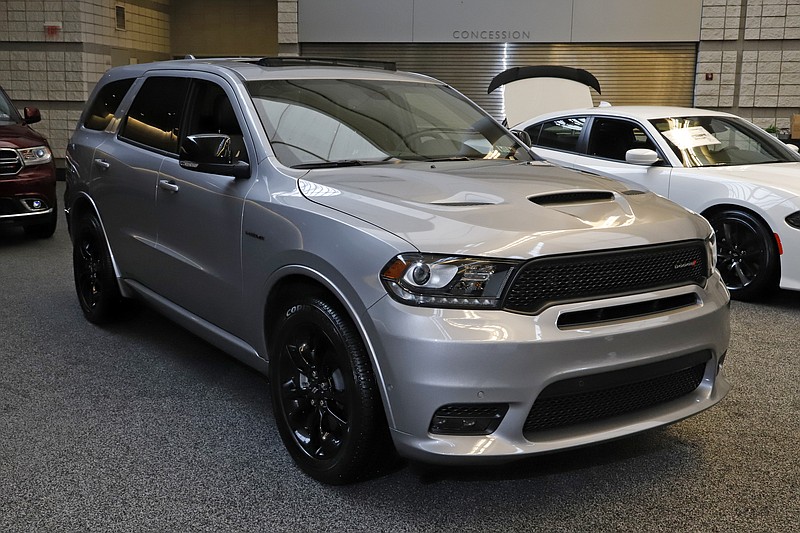 FILE - This Feb. 13, 2020 photo shows a 2020 Dodge Durango R/T Blackktop AWD on display at the 2020 Pittsburgh International Auto Show in Pittsburgh. Detroit-area automakers made their strongest showing ever in an annual survey of vehicle quality, Wednesday, June 24, as once-dominant Japanese brands faded. Most Detroit-area brands outpaced the industry average in problems per 100 vehicles, with Fiat Chrysler's Dodge brand surprisingly tying for first place with Kia of South Korea. (AP Photo/Gene J. Puskar, File)