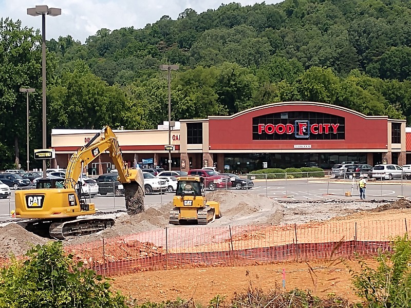 Staff photo by Mike Pare / Workers ready the site of a planned Starbucks near the Food City supermarket on Signal Mountain Road.