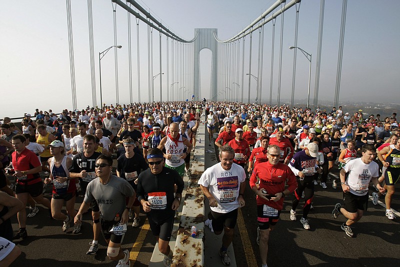 AP photo by Richard Drew / Runners cross the upper level of the Verrazano Bridge at the start of the 36th New York City Marathon on Nov. 6, 2005. This year's event, which was scheduled for Nov. 1, has been canceled because of the coronavirus pandemic.