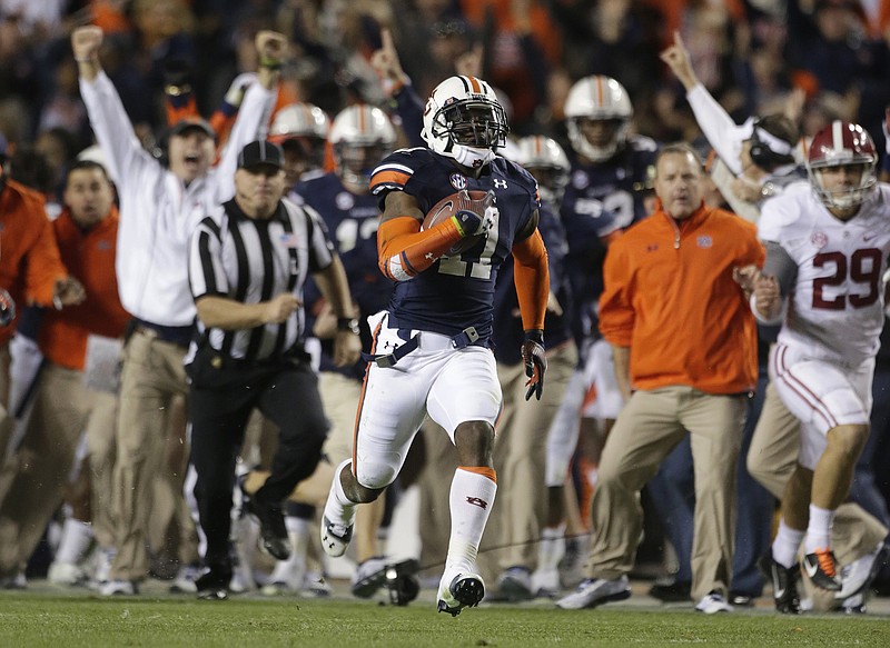 AP photo by Dave Martin / Auburn cornerback Chris Davis returns a missed field-goal attempt for the game-winning touchdown during the Tigers' 34-28 upset of top-ranked Alabama on Nov. 30, 2013, at Jordan-Hare Stadium.