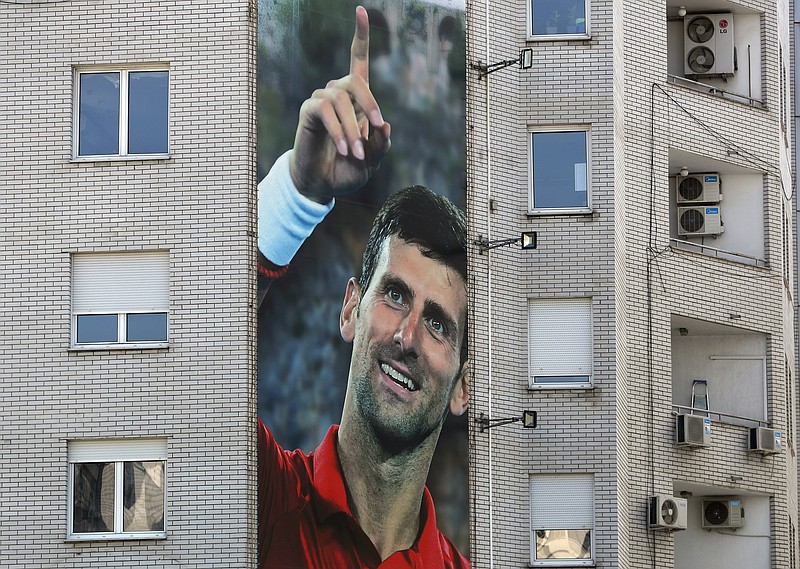 AP photo by Darko Vojinovic / A billboard depicting Serbian tennis player Novak Djokovic adorns a building in Belgrade on Wednesday. Djokovic, the ATP Tour's top-ranked player, has tested positive for the novel coronavirus after taking part in a tennis exhibition series he organized in Serbia and Croatia.