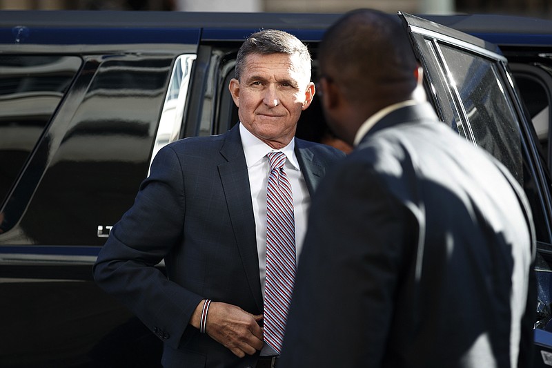 FILE - In this Dec. 18, 2018, file photo, President Donald Trump's former National Security Advisor Michael Flynn arrives at federal court in Washington. A former federal judge appointed to review the Justice Department's motion to dismiss criminal charges against ex-national security Michael Flynn has found that the government's request should be denied because there is "clear evidence of a gross abuse of prosecutorial power." Former U.S. District Judge John Gleeson says in a filing Wednesday that the government "has engaged in highly irregular conduct to benefit a political ally of the President." (AP Photo/Carolyn Kaster, File)