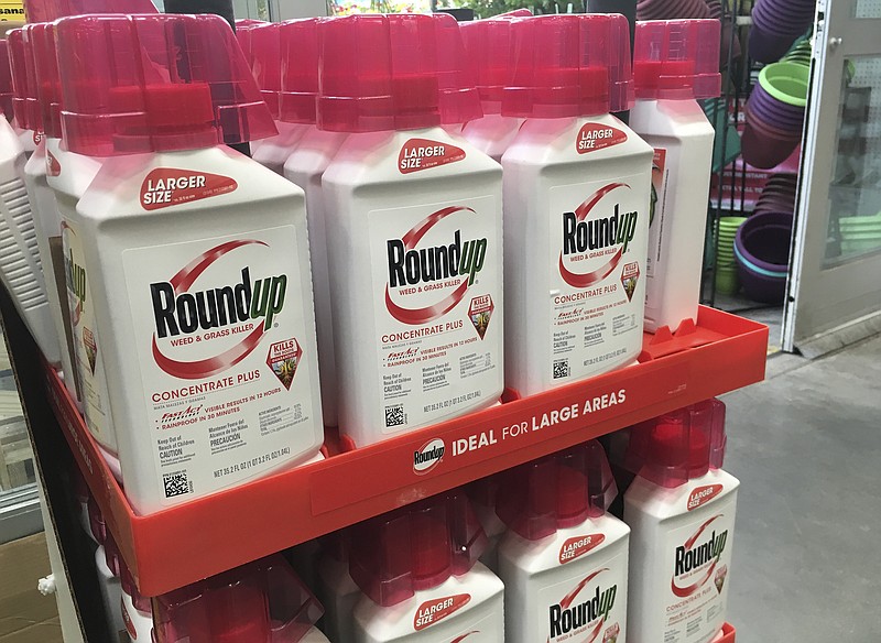 FILE - In this, Feb. 24, 2019, file photo, containers of Roundup are displayed at a store in San Francisco. German pharmaceutical company Bayer announced Wednesday, June 24, 2020, it's paying up to $10.9 billion to settle a lawsuit over subsidiary Monsanto's weedkiller Roundup, which has faced numerous lawsuits over claims it causes cancer. (AP Photo/Haven Daley, File)