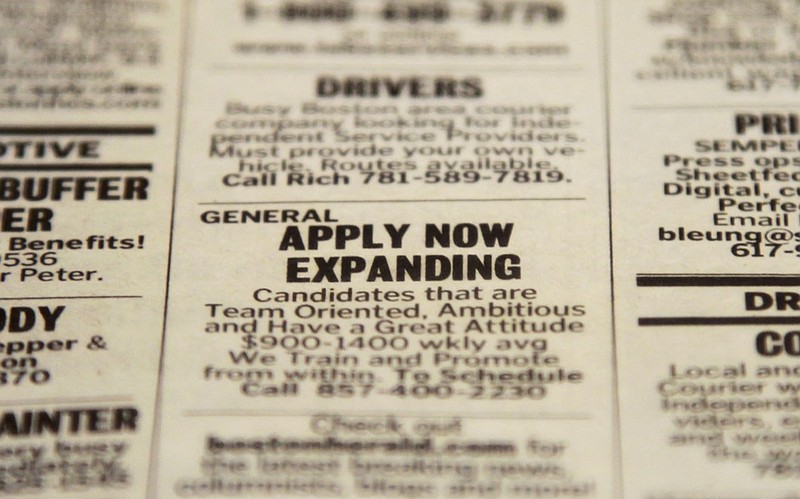 FILE - In this Tuesday, Dec. 11, 2012 file photo, an advertisement in the classified section of the Boston Herald newspaper calls attention to possible employment opportunities in Walpole, Mass. U.S. employers added 155,000 jobs in December, a steady gain that shows hiring held up during the tense negotiations to resolve the fiscal cliff.  The solid job growth wasn't enough to push down the unemployment rate, which remained 7.8 percent last month, the Labor Department said Friday, Jan. 4, 2013. The rate for November was revised up from an initially reported 7.7 percent.  (AP Photo/Steven Senne, File)