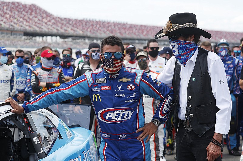 AP photo by John Bazemore / NASCAR team owner Richard Petty, right, stands with driver Bubba Wallace prior to the start of the Cup Series race Monday at Alabama's Talladega Superspeedway.