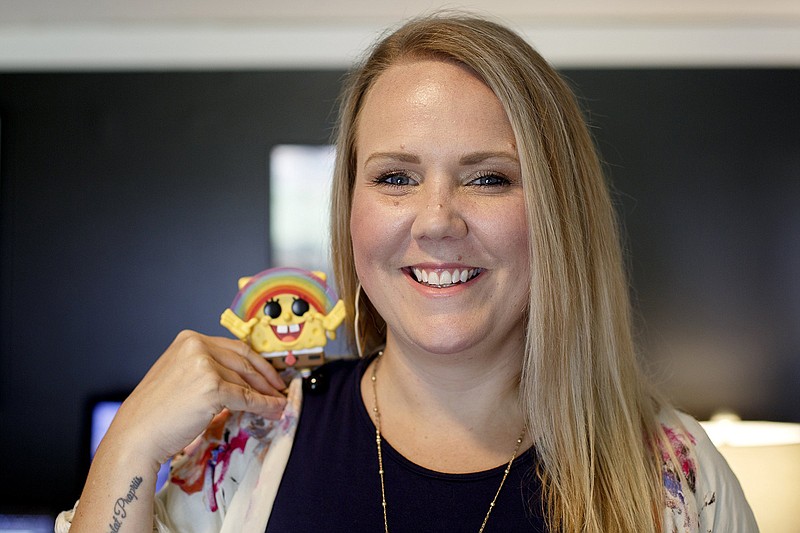 Staff photo by C.B. Schmelter / Chelsea Beebe poses in her home office in Red Bank.